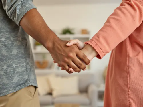 Couple holding hands, emphasizing emotional connection and trust